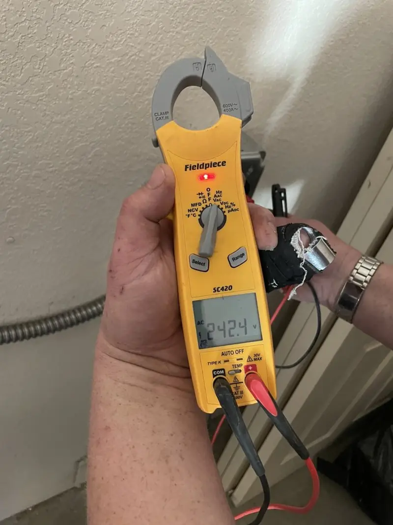 Voltage testing with clamp meter during Electrical Installation Services in Kennett Square